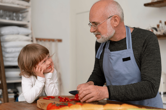 A grandfather in his 60s sharing a quiet moment with his grandson, illustrating the experience of sudden name recall struggles.